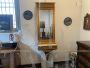 Small antique console table from the Empire period in gilded wood with mirror