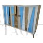 Two-door sideboard with light blue glass and brass geometries