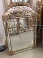 Mirror in gilded wood with flowers, antique style