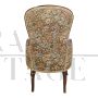 Pair of vintage wooden armchairs covered with floral fabric