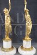 Pair of sculptural female figures in gilded bronze and alabaster