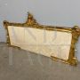 Antique 19th century bed headboard in carved wood with gold leaf