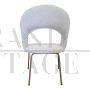 Design chair in white bouclé fabric