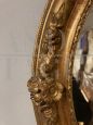 Antique oval mirror from 1840 in gold leaf