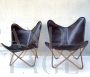 Butterfly style contemporary leather armchairs