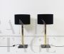 Pair of modern design lamps in brass and black marble