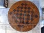 Antique round snap top table with inlaid chessboard, 19th century