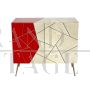 Design sideboard covered in red and parchment-colored glass