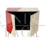 Design sideboard covered in red and parchment-colored glass