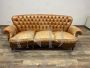 Vintage Chippendale leather sofa with tufted backrest  