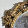 Small French oval mirror from the late 19th century in gilded wood      