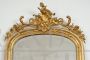 Antique Napoleon III mirror in gilded wood and carved with rocailles and roses