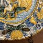 Large antique plate in Neapolitan majolica by Carlo Mollica depicting Neptune