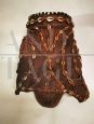 Antique African tribal mask with beads and leopard skin