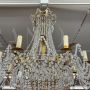 Early 1900s 8-light chandelier in gold metal with crystal drops