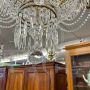 Early 1900s 8-light chandelier in gold metal with crystal drops