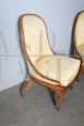 Antique pair of Charles X armchairs in walnut with cream damask fabric