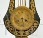 Antique French Empire lyre clock in gilded and patinated bronze                            