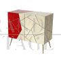 Design sideboard covered in red and parchment-colored glass