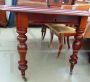 Antique English mahogany extendable dining table