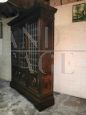 Large 1950s walnut bookcase with leaded glasses