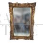 Gilded wooden mirror with floral decorations