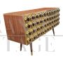 Three-door brass sideboard with circular red glass inserts