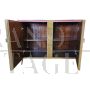 Two-door sideboard with pink glass and brass geometries