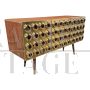 Three-door brass sideboard with circular red glass inserts        
