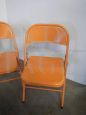 Set of 3 orange metal folding chairs, 1970s