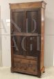 Antique Louis Philippe capuchin walnut display cabinet bookcase from the 19th century