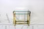 Pair of nesting tables in brass and glass, 1970s