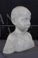 Marble bust sculpture of a child from the early 1900s