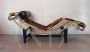 Bauhaus-inspired golden chaise longue in cowhide