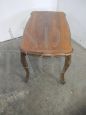 Vintage coffee table with wavy and carved legs