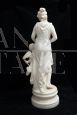 Antique sculpture of a girl with a cherub in statuary white marble