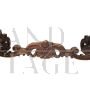 Antique carved desk table with studded leather top