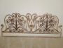 Antique wrought iron bed headboard painted with gold highlights, 19th century