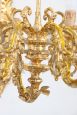 Pair of chiseled gilt bronze wall lights in antique style