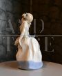 Vintage porcelain sculpture, little girl with a basket of flowers