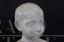 Marble bust sculpture of a child from the early 1900s