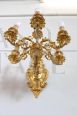 Pair of chiseled gilt bronze wall lights in antique style