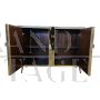 Two-door sideboard with light blue glass and brass geometries