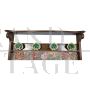 Vintage hallway coat rack covered in floral fabric