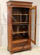 Antique Louis Philippe capuchin walnut display cabinet bookcase from the 19th century