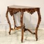 Antique Louis Philippe console table in richly carved walnut