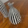 Pair of black and white striped Murano glass vases with flattened shape, 1930s - 1940s