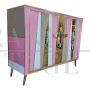 Two-door sideboard with pink glass and brass geometries