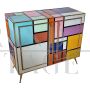 Sideboard in colored glass with illuminated mirror interior