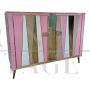 Two-door sideboard with pink glass and brass geometries